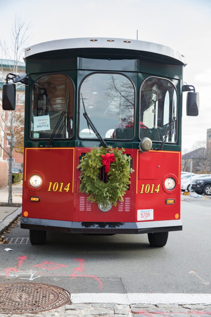 A picture of the front of the Salem Trolley with a holiday wreath