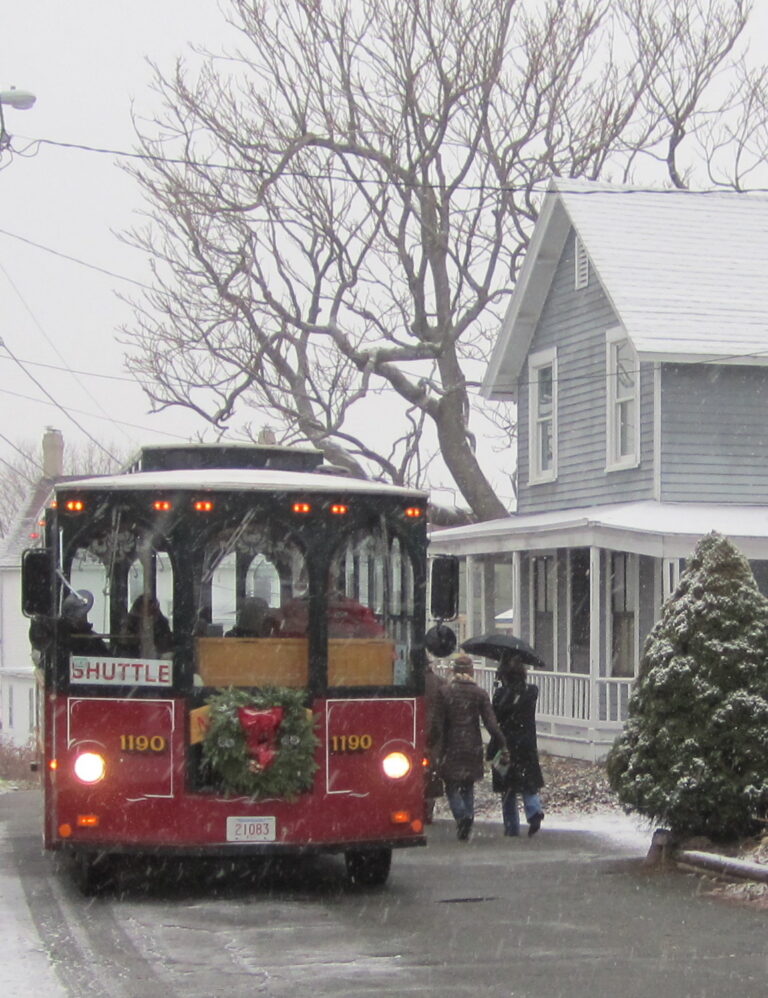 Salem Trolley decorated with a holiday wreath on a snowy Salem street Salem Trolley decorated with a holiday wreath on a snowy Salem street