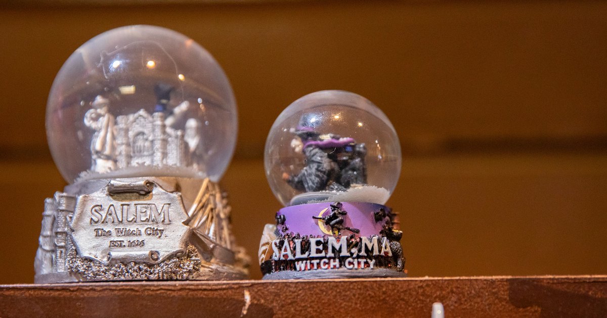 Salem snow globes displayed in a downtown shop