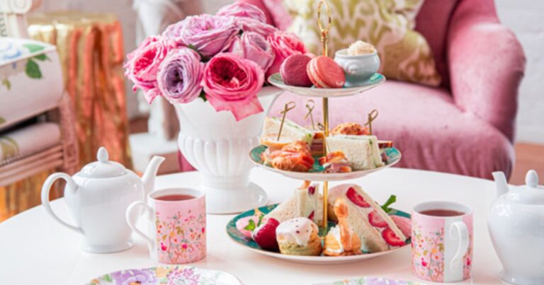 Afternoon tea with sandwiches, pastries, flowers, and tea service at Jolie Tea Company Afternoon tea with sandwiches, pastries, flowers, and tea service at Jolie Tea Company
