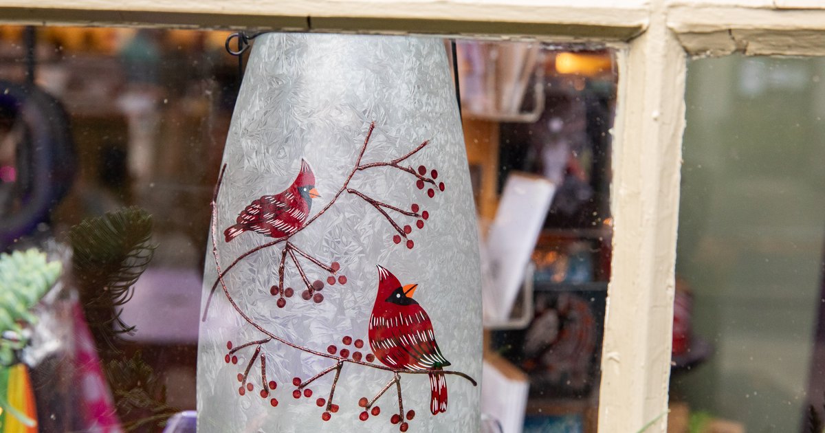 Cardinal holiday lantern in a downtown Salem shop window